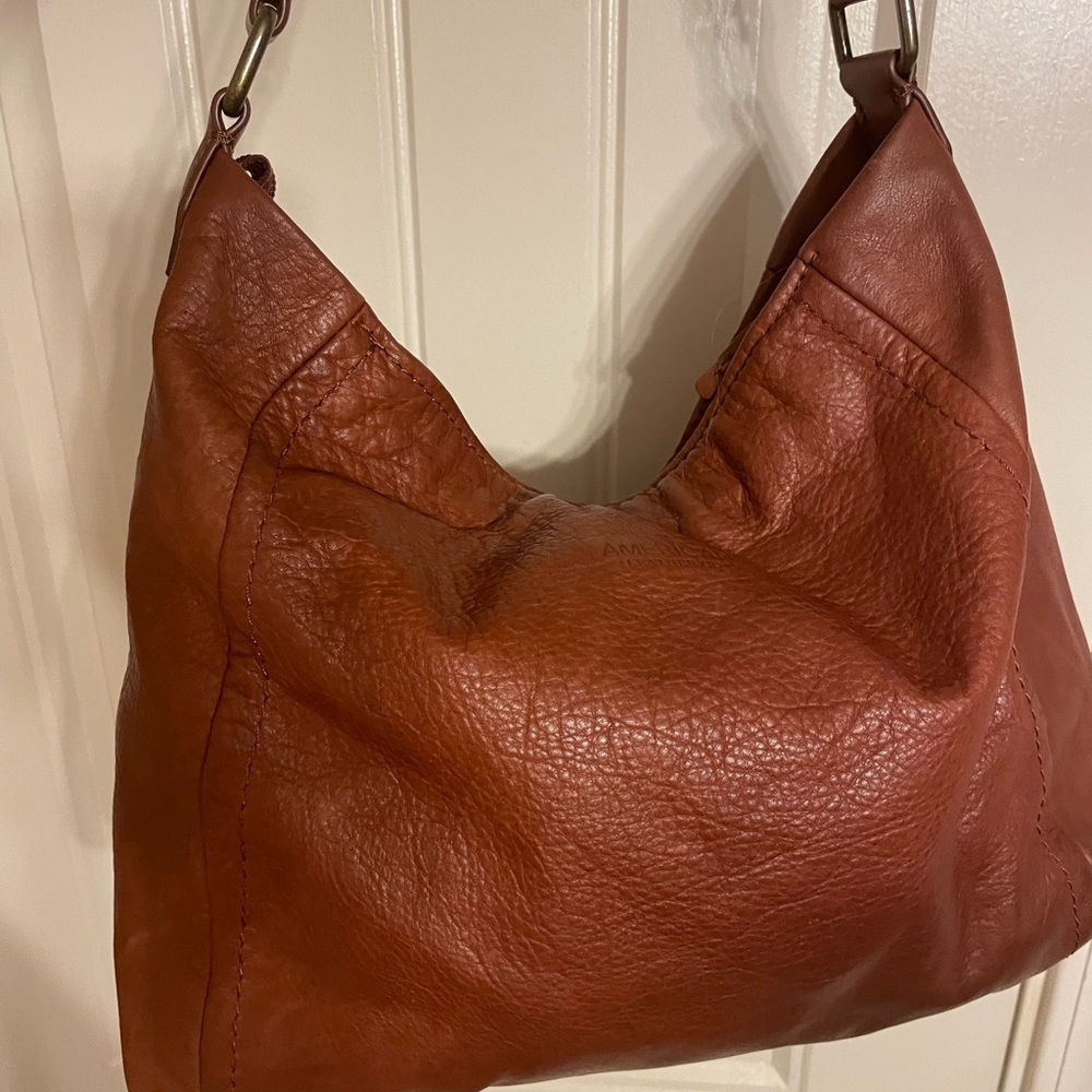 Genuine soft leather shoulder or hobo purse.